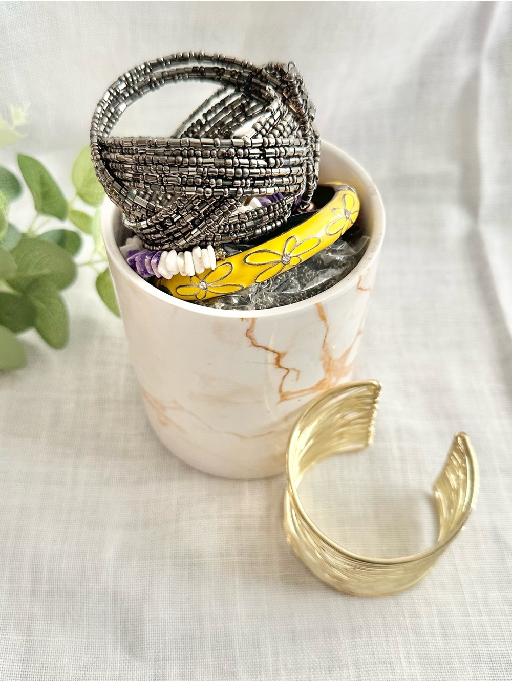 Assortment of jewelry lot + white/orange marble ceramic cup